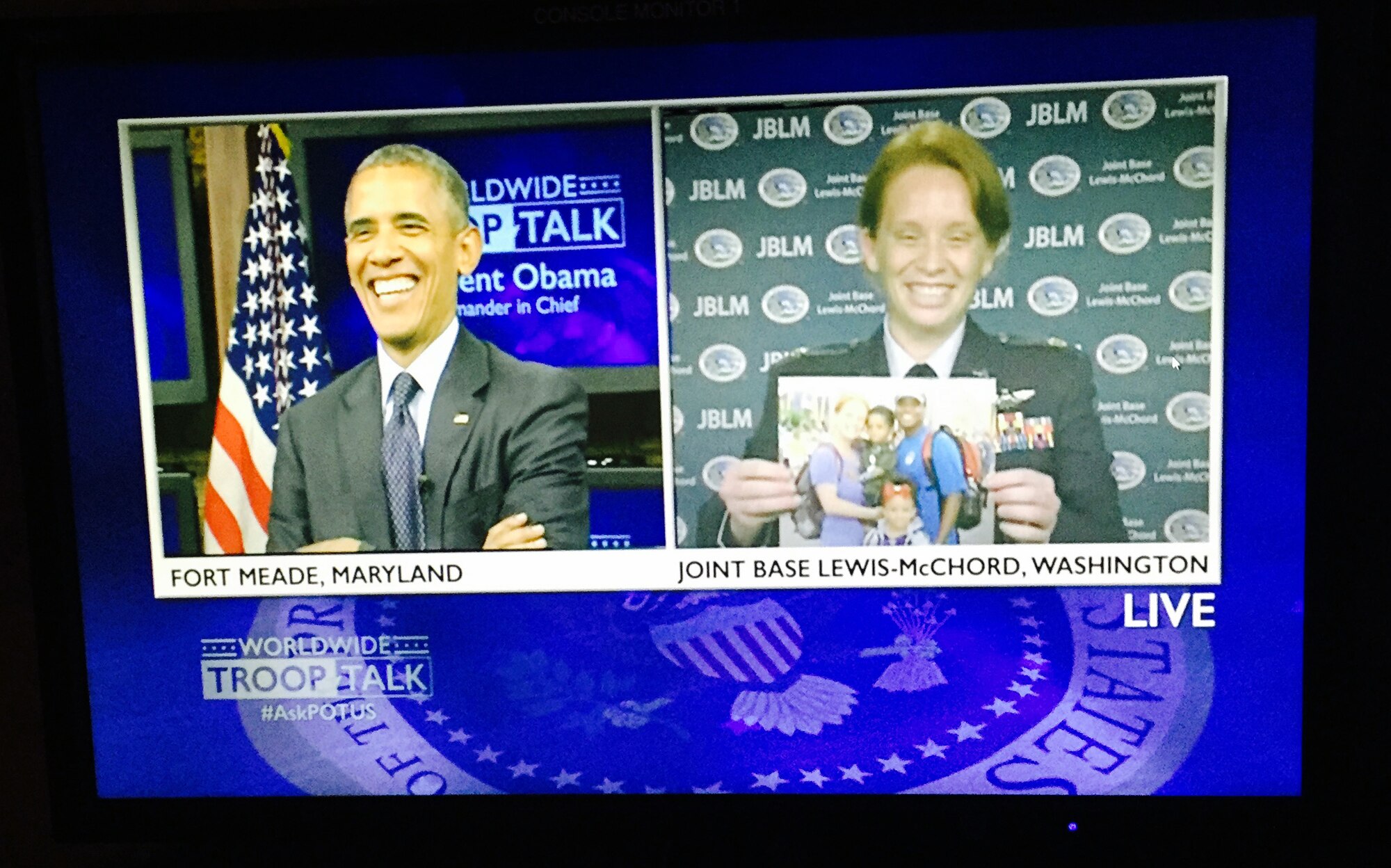 President Barack Obama and Maj. Jennifer Moore, 62nd Airlift Wing Operations Group director of staff, share a laugh during a live Defense Media Agency Worldwide Troop Talk with the President on Sept. 11th, 2015 at Ft. George G. Meade, Maryland. Moore was selected as the only representative from Joint Base Lewis-McChord to get a chance to ask the president one question during this live event. (U.S. Air Force photo/Master Sgt. Todd Wivell)