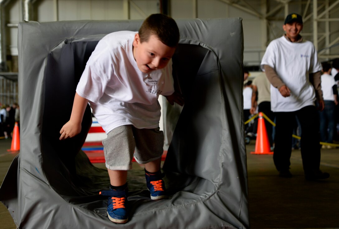 A Joan Mann Special Sports Day athlete completes an obstacle course Sept. 12, 2015, on RAF Mildenhall, England. JMSSD is an Olympic-styled event featuring a variety of sporting activities for more than 200 special-needs athletes from across England. (U.S. Air Force photo by Senior Airman Victoria H. Taylor/Released)