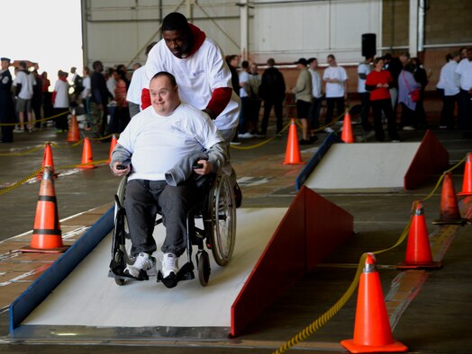 A Joan Mann Special Sports Day athlete participates in an obstacle course Sept. 12, 2015, on RAF Mildenhall, England. The event began 34 years ago when Joan Mann, a Ministry of Defence on RAF Mildenhall, wanted to find a way to bring local community and military members together to work with special-needs citizens. (U.S. Air Force photo by Senior Airman Victoria H. Taylor/Released)