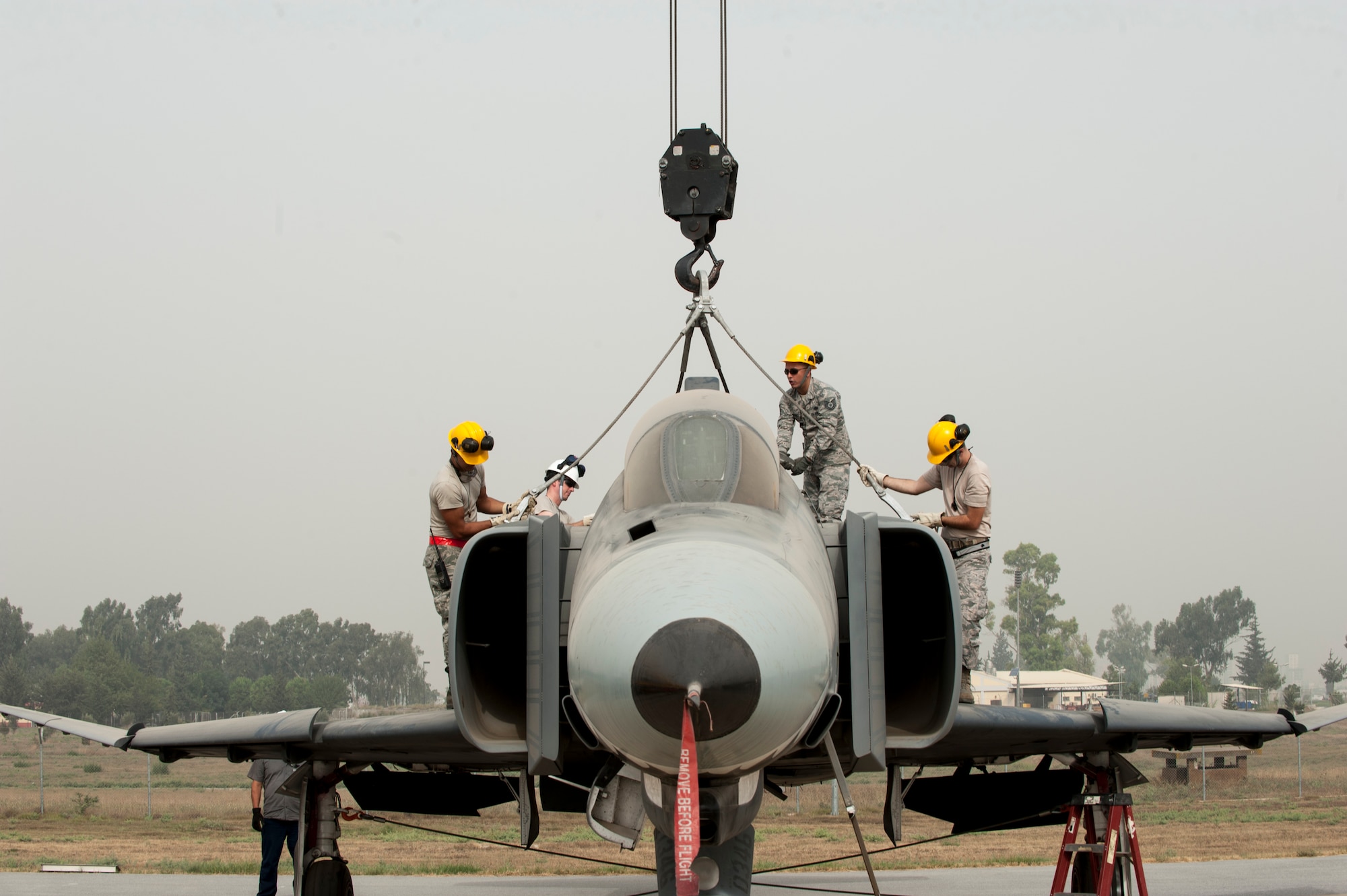 The 39th Maintenance Squadron’s Crash, Damaged, Disabled Aircraft Recovery team hoisted an aircraft with simulated damage during an exercise Sept. 10, 2015, at Incirlik Air Base, Turkey. The CCDAR team responded to a simulated Turkish F-4 aircraft nose gear collapse upon landing as part of the exercise. (U.S. Air Force photo by Airman 1st Class Cory W. Bush/Released)