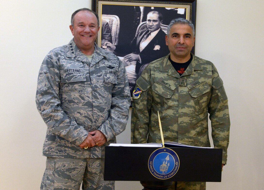 Gen. Philip M. Breedlove, NATO's Supreme Allied Commander for Europe and commander of U.S. European Command, poses for a photo after signing the 10th Tanker Base Command guest book with Brig. Gen. Ercan Van, 10th Tanker Base Command commander, during a visit Sept. 11, 2015, at Incirlik Air Base, Turkey. Breedlove met with military service members stationed at and deployed to Incirlik, toured base facilities and attended briefings about the base’s mission. (U.S. Air Force photo by Senior Airman Krystal Ardrey/Released) 