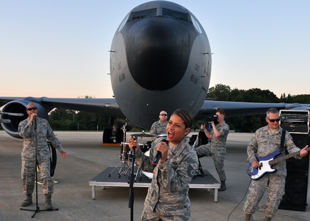 The U.S. Air Force band Max Impact performs in front of a 459th Air Refueling Wing KC-135R Stratocaster during production of their up-and-coming music video on the Joint Base Andrews flight line Aug. 26, 2015. Members of 459th Maintenance Group helped position the aircraft to set the stage for the media event. (U.S. Air Force photo/Staff Sgt. Kat Lynn Justen)

