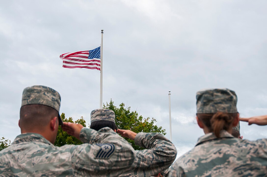 Airmen from the Vermont Air National Guard base perform retreat at the end of
a drill weekend Sept. 13, 2015. This year marked the 14th anniversary of 9/11.
(U.S. Air National Guard photo by Staff Sgt. Victoria Greenia)