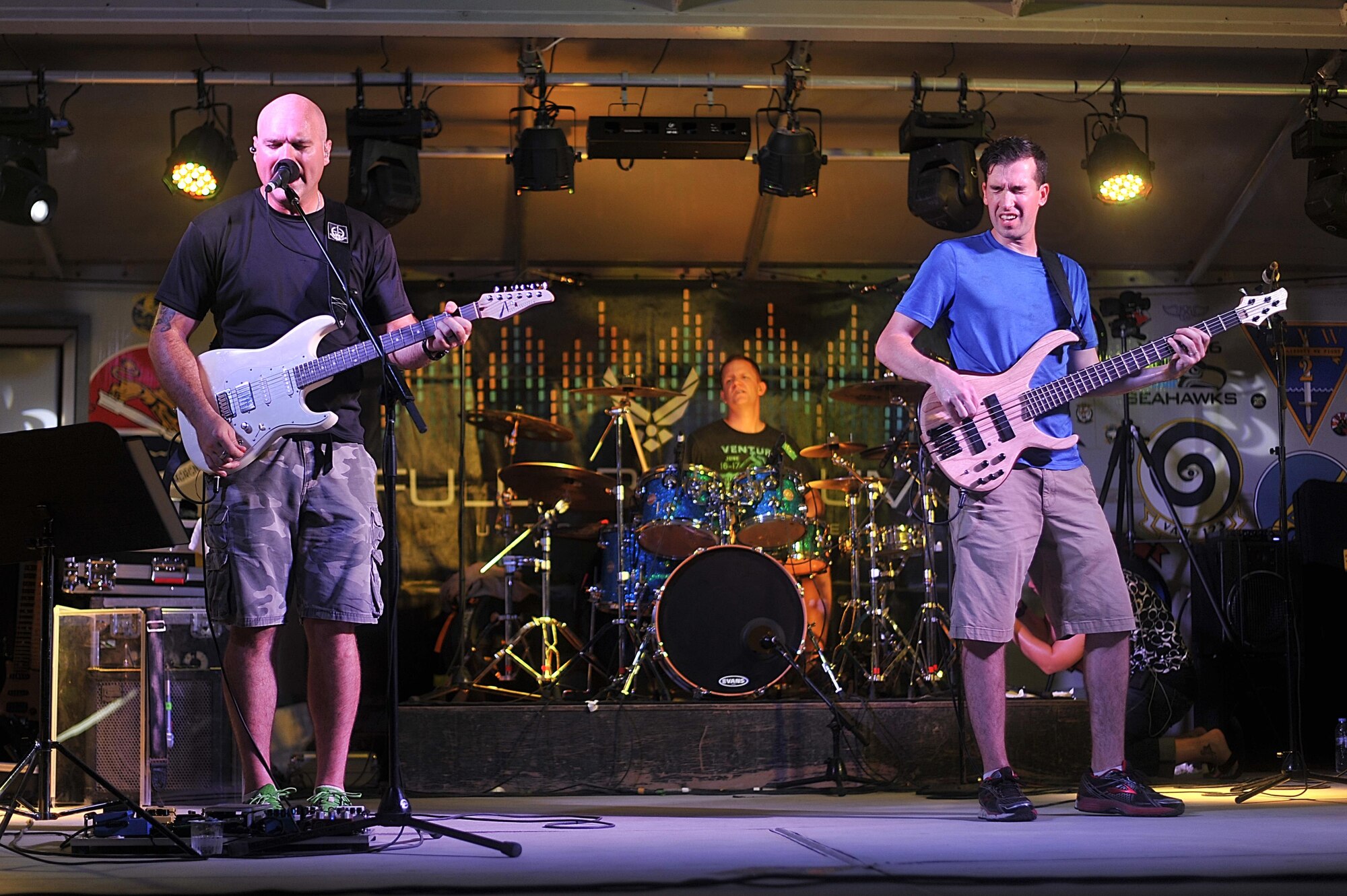 Tech. Sgt. Jason Cale, left, and Staff Sgt. Jordan Kimble, Air Forces Central Command band members,
entertain service members during a performance at an undisclosed location in Southwest Asia, Aug. 27, 
2015. The band uses music as a tool to boost troop morale. (U.S. Air Force photo by Staff Sgt. Emerson 
Nuñez/Released)