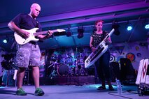 Tech. Sgt. Jason Cale and Staff Sgt. Michelle Hooper, Air Forces Central Command band members, 
entertain military members during a performance at an undisclosed location in Southwest Asia, Aug. 27, 
2015. The AFCENT band plays a wide variety of genres to accommodate different types of performances 
for different types of events. (U.S. Air Force photo by Staff Sgt. Emerson Nuñez/Released)