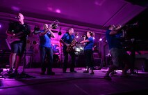Air Forces Central Command band members entertain service members during a performance at an
undisclosed location in Southwest Asia, Aug. 29, 2015. The AFCENT band is comprised of musicians who 
perform and tour throughout the area of responsibility to encourage troop morale, diplomacy and 
outreach to host nation communities. (U.S. Air Force photo by Staff Sgt. Emerson Nuñez/Released)