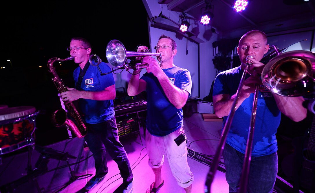 The Air Forces Central Command band horn section, perform for service members during a concert at an 
undisclosed location in Southwest Asia, Aug. 28, 2015. The AFCENT band is composed of musicians who 
perform and tour throughout the Central Command Area of Responsibility to encourage troop morale, 
diplomacy and outreach to host nation communities. (U.S. Air Force photo by Staff Sgt. Emerson 
Nuñez/Released)