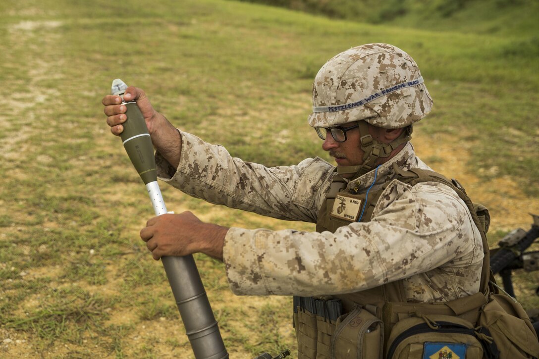 Cpl. Joey Wallace and his squad compete against other mortarmen during the 3rd Marine Division Annual Squad Competition, at Camp Hansen, Okinawa, Japan, Sept. 3, 2015. Wallace, from Ocean City, Maryland, is a mortarman with weapons company, 3rd Battalion, 3rd Marine Regiment, 3rd Marine Division. 