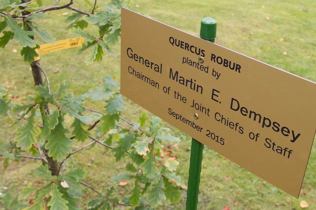 A sign marks the spot where U.S. Army Gen. Martin E. Dempsey, chairman of the Joint Chiefs of Staff, plants an oak tree at the Estonian Defense Forces Headquarters in Tallinn, Estonia, Sept. 14, 2015. The tree symbolizes a long and growing friendship between the two nations' militaries. DoD photo by D. Myles Cullen