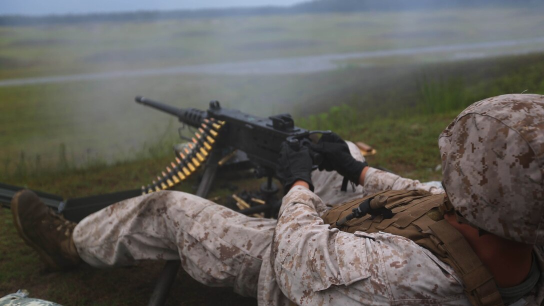 Lance Cpl. Aaron Philson fires a Browning M2 .50-caliber machine gun during a weapons familiarization range at Marine Corps Base Camp Lejeune, North Carolina, Aug. 27, 2015. More than 100 Marines from Marine Air Support Squadron 1 honed their weapons skills with the M240B machine gun, Browning M2 .50-caliber machine gun and the M1014 combat shotgun. Marines from various military job specialties received hands-on experience that allows them to improve crucial skills and become well-rounded war fighters. Philson is an aviation communications technician with MASS-1.