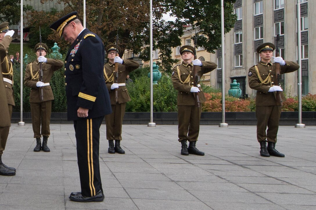U.S. Army Gen. Martin E. Dempsey, chairman of the Joint Chiefs of Staff, bows his head in a moment of silence at the War of Independence Victory Column in Tallinn, Estonia, Sept. 14, 2015. The site was opened on June 23, 2009 as a memorial for those who fell during the Estonian War of Independence. DoD photo by D. Myles Cullen