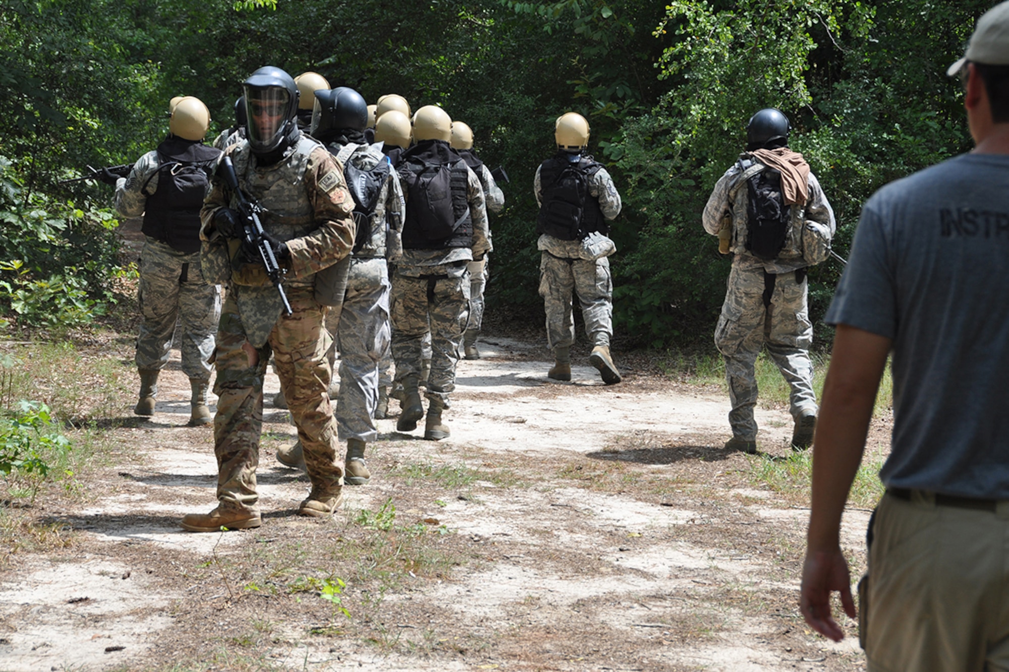 Members of the Chaplain Candidate Intensive Internship participate in a simulated search and recovery mission during a Field Exercise at the Combat Readiness School, Robins Air Force Base, Ga. July 13, 2015. Open to seminary and professional religious school students, the CCII serves as the second of four phases of the Chaplain Candidate Training Plan, evaluating candidates’ suitability and potential for commissioning as an Air Force Chaplain. (U.S. Air Force photo by Master Sgt. James Branch)