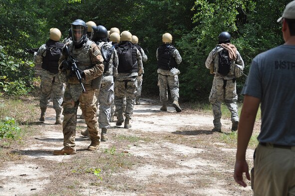 Members of the Chaplain Candidate Intensive Internship participate in a simulated search and recovery mission during a Field Exercise at the Combat Readiness School, Robins Air Force Base, Ga. July 13, 2015. Open to seminary and professional religious school students, the CCII serves as the second of four phases of the Chaplain Candidate Training Plan, evaluating candidates’ suitability and potential for commissioning as an Air Force Chaplain. (U.S. Air Force photo by Master Sgt. James Branch)