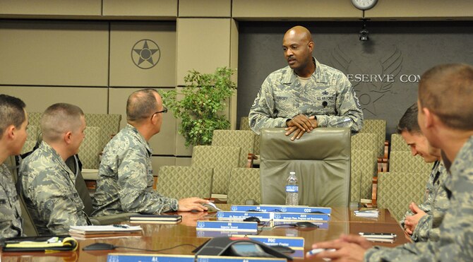 Chief Master Sgt. Cameron B. Kirksey, Air Force Reserve Command command chief, provides the Enlisted Leader Perspective to 17 chaplain candidates during the Chaplain Candidate Intensive Internship July 13, 2015. In addition to Robins Air Force Base, Ga., the candidates visited six different military installations and met with service members from all branches of the armed forces. (U.S. Air Force photo by Master Sgt. James Branch)