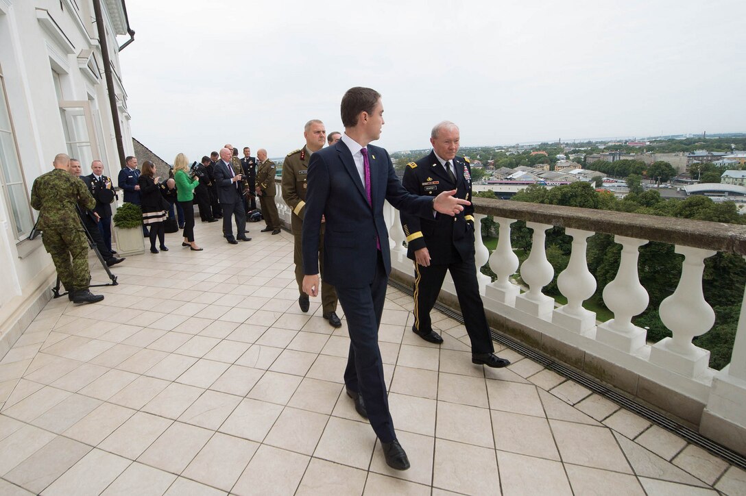 Estonian Prime Minister, Taavi Roivas, left, and U.S. Army Gen. Martin E. Dempsey, chairman of the Joint Chiefs of Staff, talk on the balcony of the Stenbock House in Talinn, Estonia, Sept. 14, 2015. Photo by D. Myles Cullen