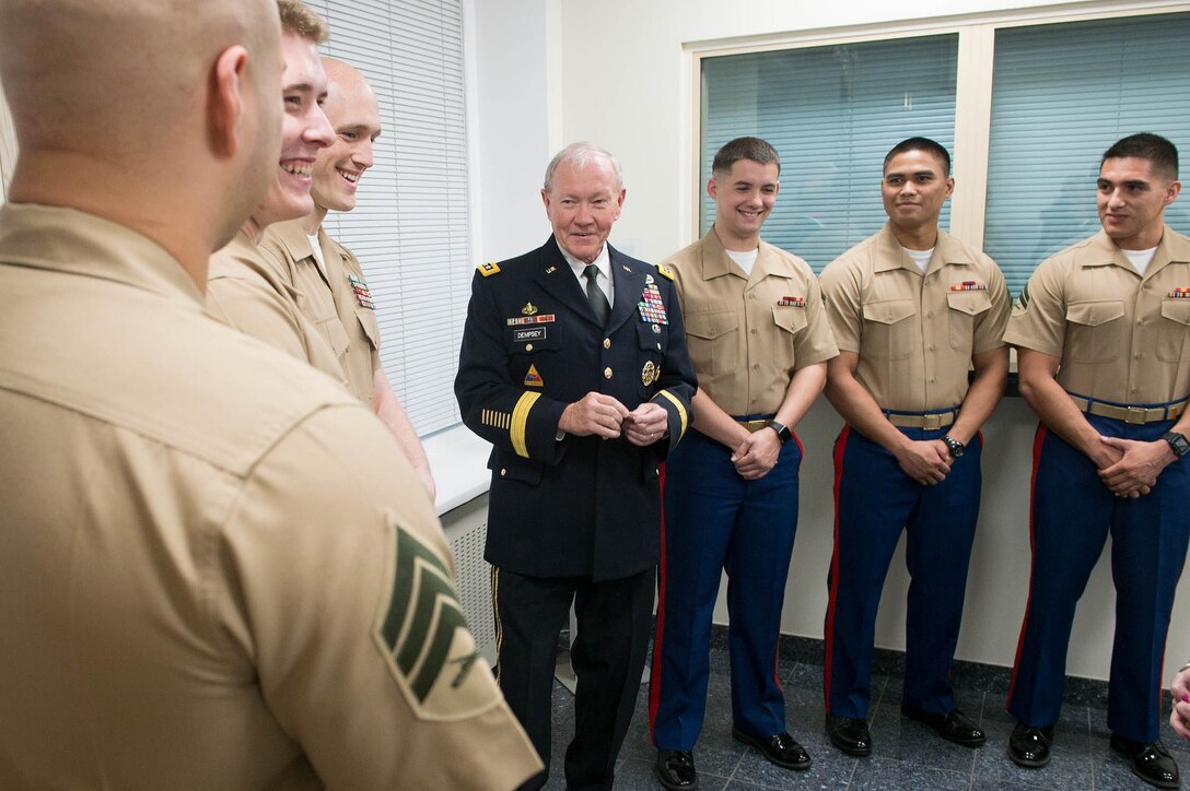 U.S. Army Gen Martin Dempsey, chairman of the Joint Chiefs of Staff, meets with Marines who provide security at the U.S. Embassy in Tallinn, Estonia, Sept 14, 2015. DoD photo by D. Myles Cullen