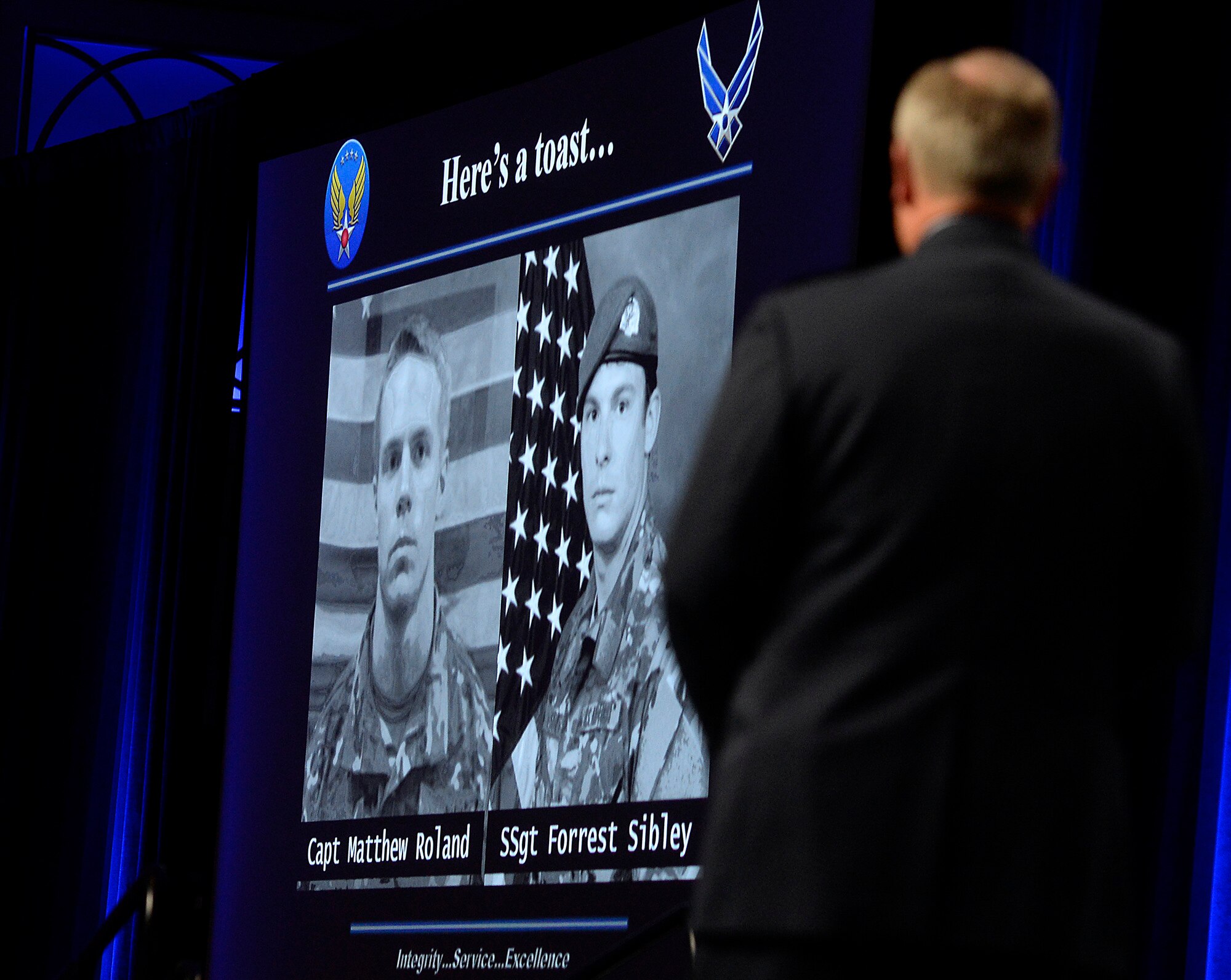 Air Force Chief of Staff Gen. Mark A. Welsh III honors two fallen special tactics Airmen during his Air Force Update address at the Air Force Association's Air and Space Conference and Technology Exposition Sept. 15, 2015, in Washington, D.C.  Capt. Matthew D. Roland and Staff Sgt. Forrest B. Sibley were killed Aug. 26, 2015, in Afghanistan. (U.S. Air Force photo/Scott M. Ash)  