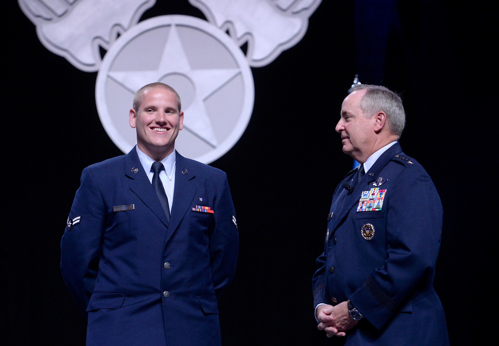 Air Force Chief of Staff Gen. Mark A. Welsh III speaks with Airman 1st Class Spencer Stone during Welsh's Air Force Update address at the Air Force Association's Air and Space Conference and Technology Exposition Sept. 15, 2015, in Washington, D.C. (U.S. Air Force photo/Scott M. Ash)  