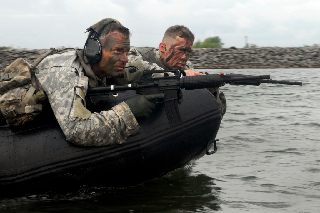 New York Army National Guard Sgt. 1st Class David Ditullio and Sgt. John Krupa stand watch at the bow of an F470 Combat Rubber Raiding Craft during a troop training exercise in Buffalo, N.Y., Sept. 13, 2015. Ditullio and Krupa are infantrymen assigned to the New York Army National Guard’s Troop C, 2nd Squadron, 101st Cavalry Regiment. New York National Guard photo by Army Spc. Alexander Rector