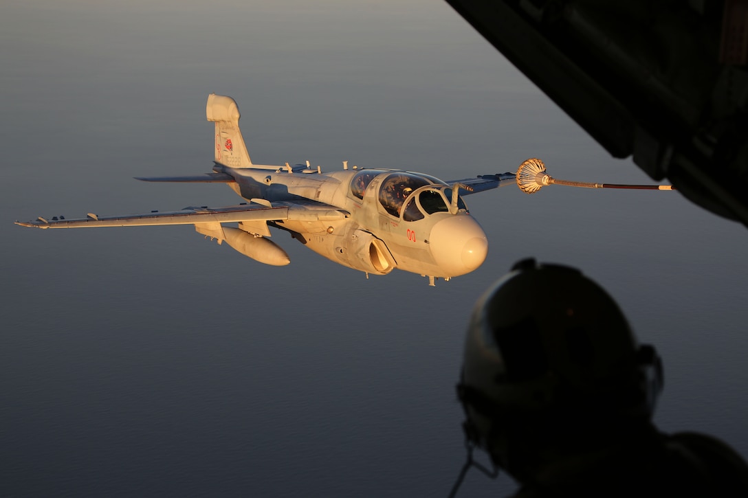 An EA-6B Prowler, belonging to 2nd Marine Aircraft Wing attaches to the hose of a KC-130 Super Hercules while conducting aerial maneuvers during an air-to-air refuel training exercise over the Atlantic Ocean Sept. 14, 2015. Aircraft from Marine Corps Air Station Cherry Point, N.C., were supported by Marine Aerial Refueler Transport Squadron 252 off the eastern Atlantic coast during the training exercise to hone their aerial refueling skills. VMGR-252 is the force multiplier for the Marine Air-Ground Task Force as it extends the operational reach of other aviation platforms under all weather conditions, day or night during expeditionary, joint or combined operations. (U.S. Marine Corps photo by Cpl. N.W. Huertas/Released)