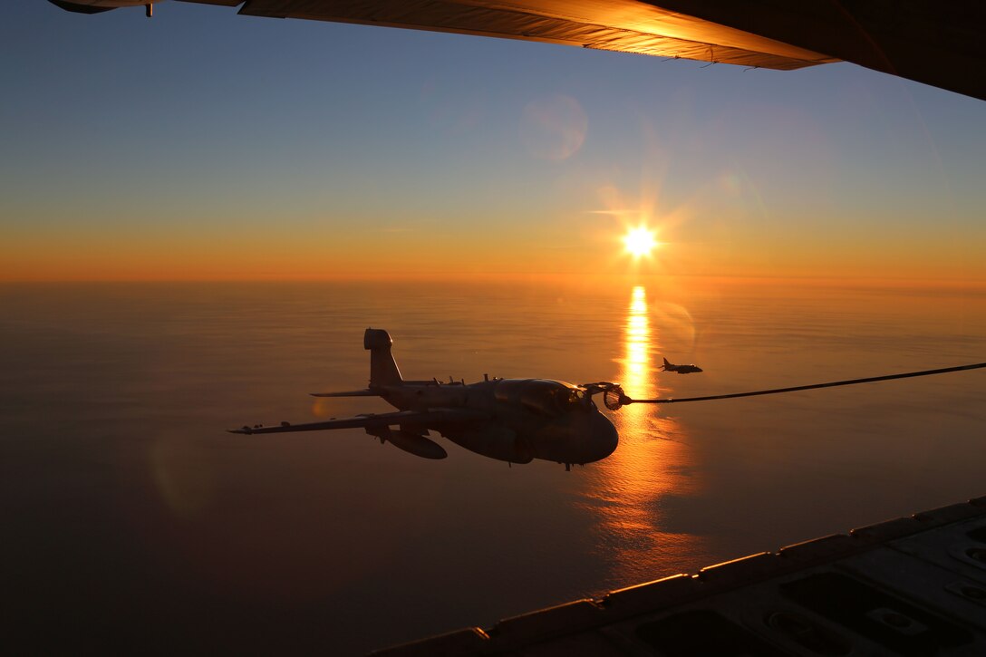 An EA-6B Prowler, belonging to 2nd Marine Aircraft Wing attaches to the hose of a KC-130J Super Hercules while conducting aerial maneuvers during an air-to-air refuel training exercise over the Atlantic Ocean Sept. 14, 2015. Aircraft from Marine Corps Air Station Cherry Point, N.C., were supported by Marine Aerial Refueler Transport Squadron 252 off the eastern Atlantic coast during the training exercise to hone their aerial refueling skills. VMGR-252 is the force multiplier for the Marine Air-Ground Task Force as it extends the operational reach of other aviation platforms under all weather conditions, day or night during expeditionary, joint or combined operations. (U.S. Marine Corps photo by Cpl. N.W. Huertas/Released)