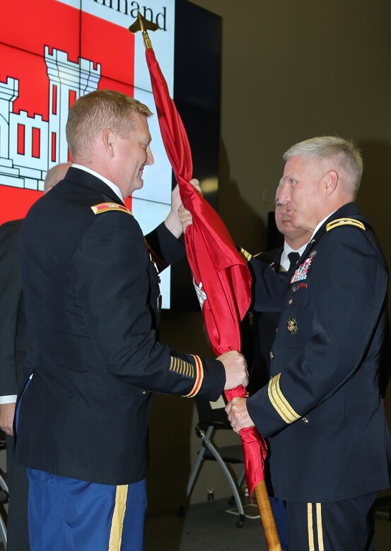 Col. Bryan S. Green accepted the Corps colors from Maj. Gen. Richard L. Stevens as he assumed command at the change of command ceremony at the ERDC-ITL Auditorium Sept. 10.