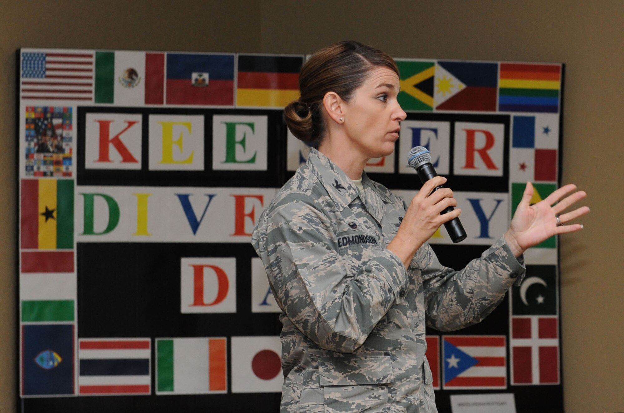 Col. Michele Edmondson, 81st Training Wing commander, delivers opening remarks at Diversity Day Sept. 15, 2015, at the Bay Breeze Event Center, Keesler Air Force Base, Miss. The cultural celebration included food sampling, a photo booth and booths with information about countries around the world and other special emphasis groups. (U.S. Air Force photo by Kemberly Groue)