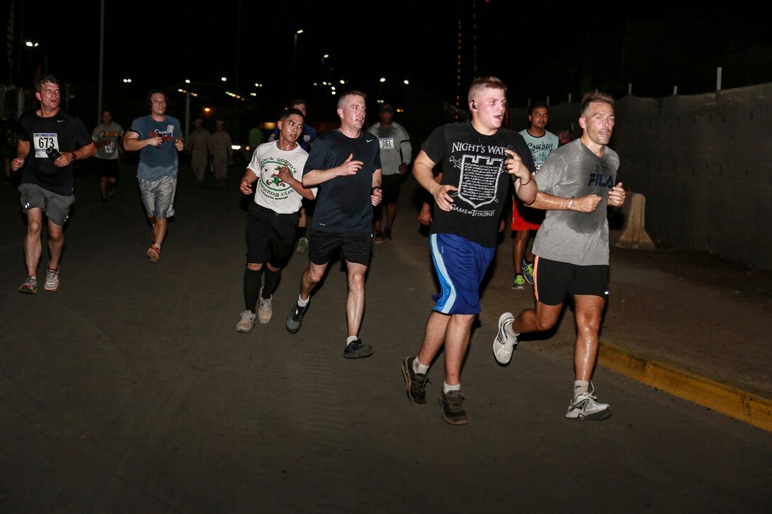 CAMP LEMONNIER, Djibouti (Sept. 6, 2015) U.S. Marines with the 15th Marine Expeditionary Unit, alongside other service members, run a 5K race aboard Camp Lemonnier. The Marines used the race to build camaraderie, acclimatize to Djibouti’s temperatures, and stay fit. Elements of the 15th MEU are preparing to conduct bilateral training with the 5th Overseas Combined Arms Regiment (RIAOM) in Djibouti in order to improve interoperability between the MEU and the French military. (U.S. Marine Corps photo by Sgt. Steve H. Lopez/Released)