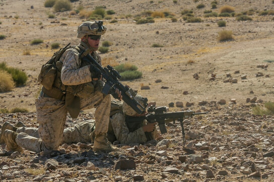 SOUTHWEST ASIA (Sept. 2, 2015) U.S. Marines with India Company, Battalion Landing Team 3rd Battalion, 1st Marine Regiment, 15th Marine Expeditionary Unit, provide covering fire during a bi-lateral training exercise. The 15th MEU, embarked aboard the ships of the ESX ARG, is a forward-deployed, flexible sea-based MAGTF capable of engaging with regional partners and maintaining regional security. (U.S. Marine Corps photo by Sgt. Jamean Berry/Released)