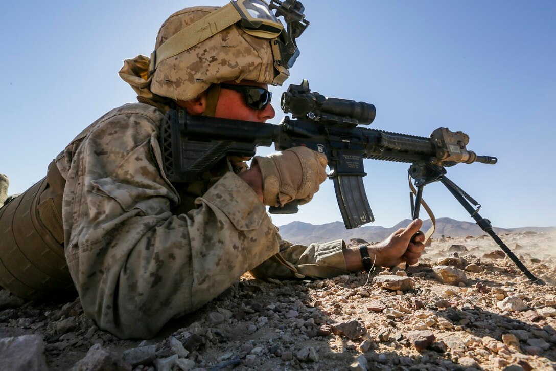 SOUTHWEST ASIA (Sept. 2, 2015) U.S. Marine Lance Cpl. Joseph Linton provides covering fire during a bi-lateral training exercise. Linton is an infantry automatic rifle gunner with India Company, Battalion Landing Team 3rd Battalion, 1st Marine Regiment, 15th Marine Expeditionary Unit. The 15th MEU, embarked aboard the ships of the ESX ARG, is a forward-deployed, flexible sea-based MAGTF capable of engaging with regional partners and maintaining regional security. (U.S. Marine Corps photo by Sgt. Jamean Berry/Released)