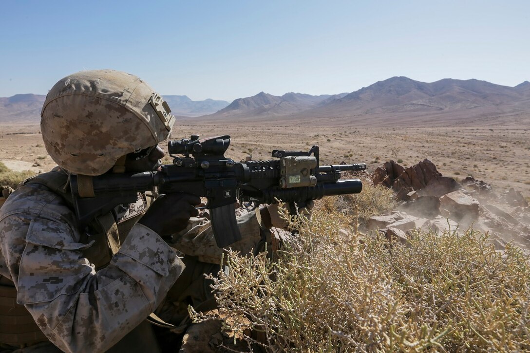SOUTHWEST ASIA (Sept. 2, 2015) U.S. Marine Cpl. Million Suddler provides covering fire during a bi-lateral training exercise.  Suddler is a team leader with India Company, Battalion Landing Team 3rd Battalion, 1st Marine Regiment, 15th Marine Expeditionary Unit. The 15th MEU, embarked aboard the ships of the ESX ARG, is a forward-deployed, flexible sea-based MAGTF capable of engaging with regional partners and maintaining regional security. (U.S. Marine Corps photo by Sgt. Jamean Berry/Released)