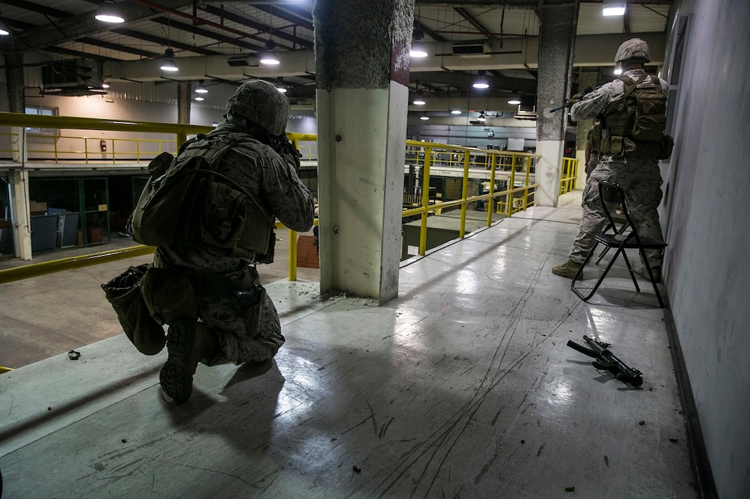 NAVAL SUPPORT ACTIVITY BAHRAIN (Sept. 9, 2015) U.S. Marines with the Fleet Anti-terrorism Security Team practice close-quarter battle tactics aboard Naval Support Activity Bahrain. These Marines were sharing techniques, tactics, and procedures with the 15th Marine Expeditionary Unit’s Force Reconnaissance Detachment. The 15th MEU is embarked with the Essex Amphibious Ready Group and deployed to maintain regional security in the U.S. 5th Fleet area of operations. (U.S. Marine Corps photo by Cpl. Anna Albrecht/Released)