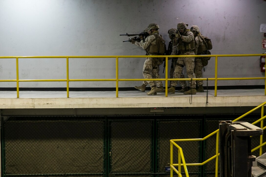 NAVAL SUPPORT ACTIVITY BAHRAIN (Sept. 9, 2015) U.S. Marines with the Fleet Anti-terrorism Security Team practice close-quarter battle tactics aboard Naval Support Activity Bahrain. These Marines were sharing techniques, tactics, and procedures with the 15th Marine Expeditionary Unit’s Force Reconnaissance Detachment. The 15th MEU is embarked with the Essex Amphibious Ready Group and deployed to maintain regional security in the U.S. 5th Fleet area of operations. (U.S. Marine Corps photo by Cpl. Anna Albrecht/Released)
