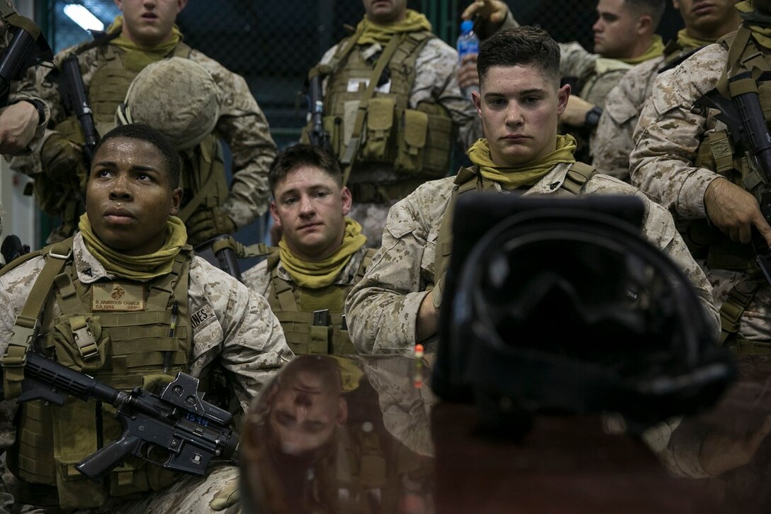 NAVAL SUPPORT ACTIVITY BAHRAIN (Sept. 9, 2015) U.S. Marines with the Fleet Anti-terrorism Security Team analyze their close-quarter battle tactics aboard Naval Support Activity Bahrain. These Marines were sharing techniques, tactics, and procedures with the 15th Marine Expeditionary Unit’s Force Reconnaissance Detachment. The 15th MEU is embarked with the Essex Amphibious Ready Group and deployed to maintain regional security in the U.S. 5th Fleet area of operations. (U.S. Marine Corps photo by Cpl. Anna Albrecht/Released)