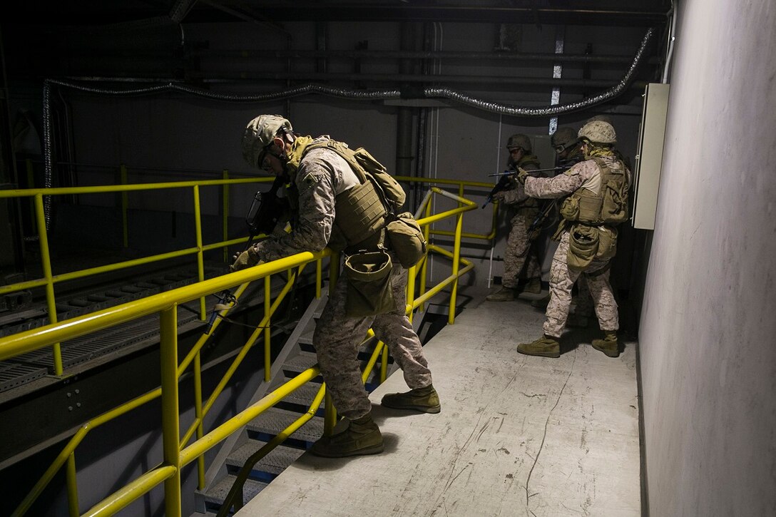 NAVAL SUPPORT ACTIVITY BAHRAIN (Sept. 9, 2015) U.S. Marines with the Fleet Anti-terrorism Security Team practice close-quarter battle tactics aboard Naval Support Activity Bahrain. These Marines were sharing techniques, tactics, and procedures with the 15th Marine Expeditionary Unit’s Force Reconnaissance Detachment. The 15th MEU is embarked with the Essex Amphibious Ready Group and deployed to maintain regional security in the U.S. 5th Fleet area of operations. (U.S. Marine Corps photo by Cpl. Anna Albrecht/Released)