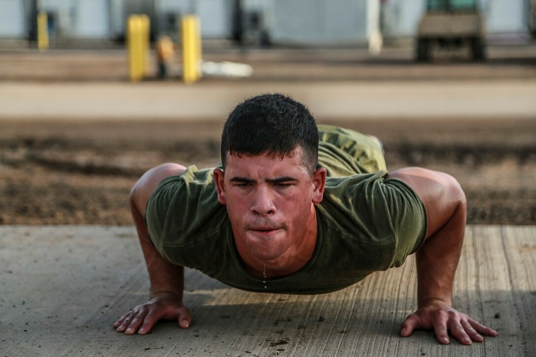 CAMP LEMONNIER, Djibouti (Sept. 11, 2015) U.S. Marine Lance Cpl. George Camden does push-ups during unit physical training. Camden is a driver with Weapons Company, Battalion Landing Team 3rd Battalion, 1st Marine Regiment, 15th Marine Expeditionary Unit. The Marines use unit PT to acclimatize to Djibouti’s temperatures, and stay fit. Elements of the 15th MEU are preparing to conduct bilateral training with the 5th Overseas Combined Arms Regiment (RIAOM) in Djibouti in order to improve interoperability between the MEU and the French military. (U.S. Marine Corps photo by Sgt. Steve H. Lopez/Released)