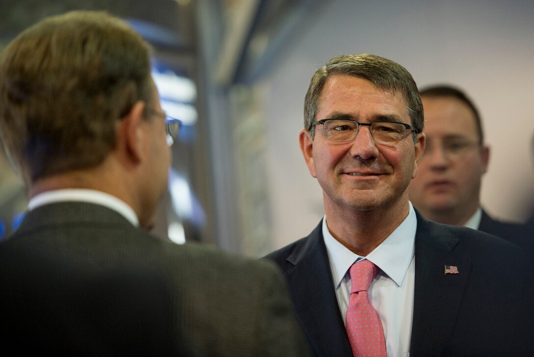 Defense Secretary Ash Carter speaks with several exhibitors after delivering remarks at the Air Force Association's Air and Space Conference in National Harbor, Md., Sept. 16, 2015. U.S. Air Force photo by Senior Master Sgt. Adrian Cadiz