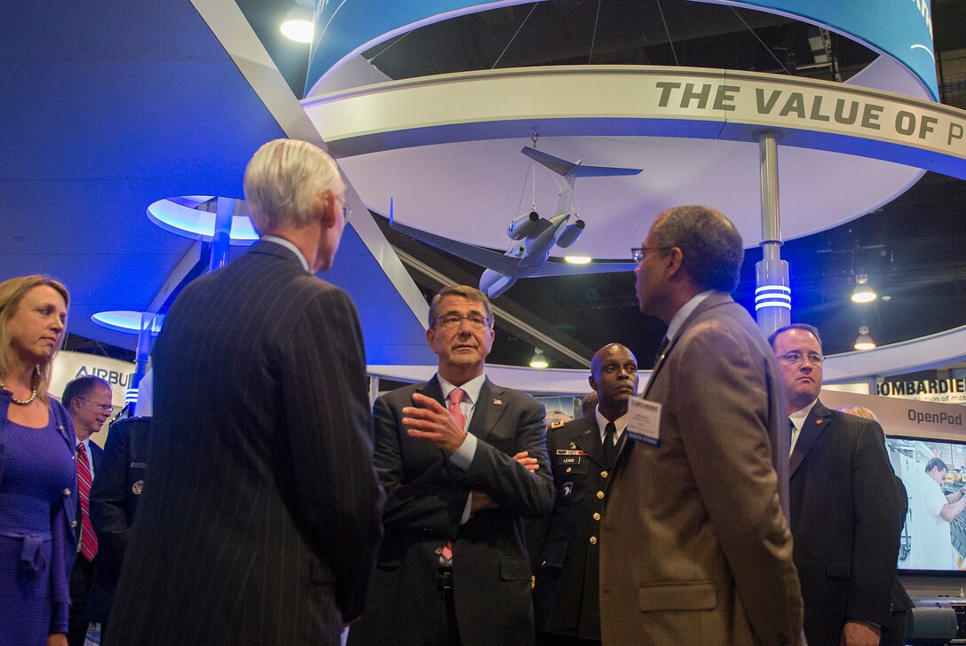 Defense Secretary Ash Carter speaks with several exhibitors after delivering remarks at the Air Force Association's Air and Space Conference at the Gaylord National Resort and Convention Center in National Harbor, Md., Sept. 16, 2015. U.S. Air Force photo by Senior Master Sgt. Adrian Cadiz