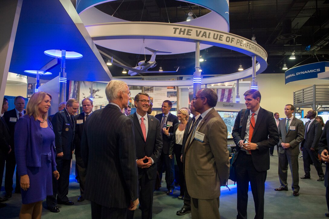 Defense Secretary Ash Carter speaks with several exhibitors after delivering remarks at the Air Force Association's Air and Space Conference in National Harbor, Md., Sept. 16, 2015. U.S. Air Force photo by Senior Master Sgt. Adrian Cadiz