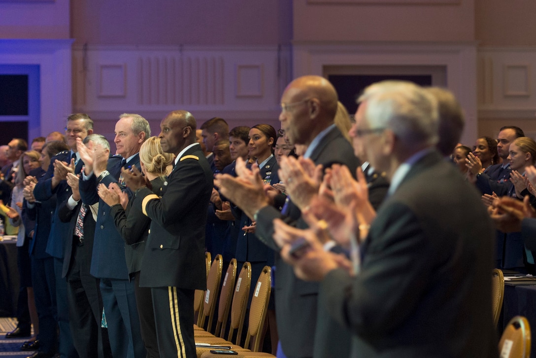 Air Force Chief of Staff Gen. Mark A. Welsh III, center, and aother attendees applaud as Defense Secretary Ash Carter concludes remarks at the Air Force Association's Air and Space Conference in National Harbor, Md., Sept. 16, 2015. U.S. Air Force photo by Senior Master Sgt. Adrian Cadiz