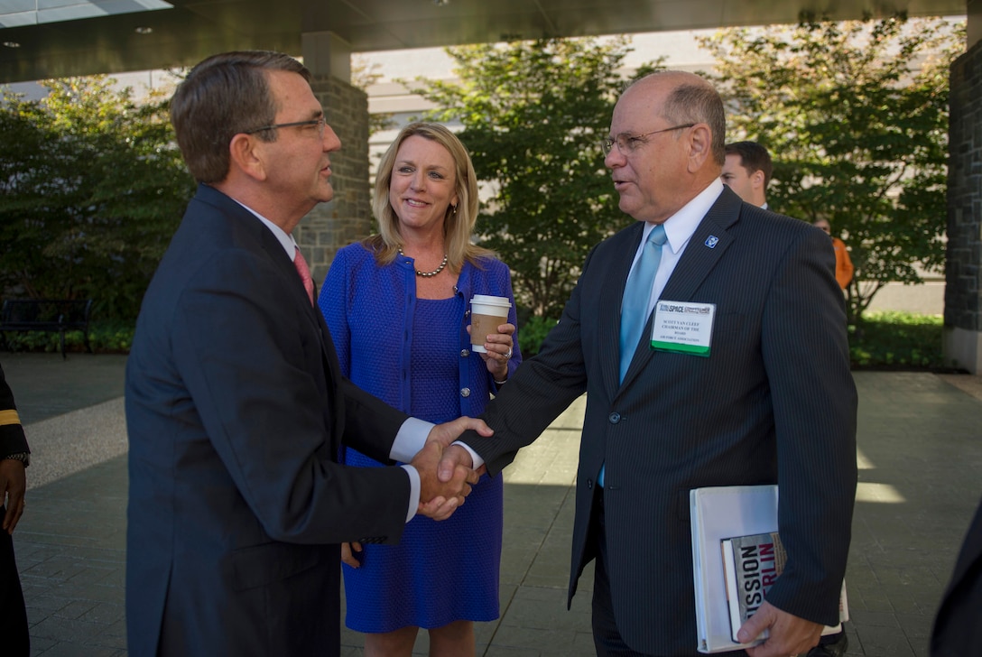 Defense Secretary Ash Carter shakes hands with Scott Van Cleef, board chairman of the Air Force Association, as he arrives to make remarks at the Air Force Association's Air and Space Conference in National Harbor, Md., Sept. 16, 2015. U.S. Air Force photo by Senior Master Sgt. Adrian Cadiz