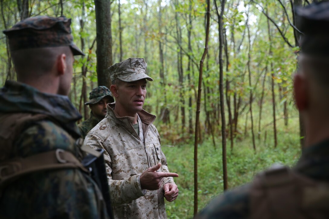 EVANGOLA STATE PARK, N.Y. - Col. Morgan G. Mann, deputy commander of 25th Marine Regiment, 4th Marine Division, Marine Forces Reserve, speaks to Marines with Charlie Co., 1st Battalion, 25th Marine Regiment, 4th MARDIV, MARFORRES and members of the Canadian Army Royal Hamilton Light Infantry, Wentworth Regiment, after a patrolling engagement with another platoon Sept. 12, 2015, during exercise Lake Effect. Mann commented on the way the Marines and Canadians reacted to an ambush assault by another platoon. (U.S. Marine Corps Photo By Cpl. J. Gage Karwick/Released)