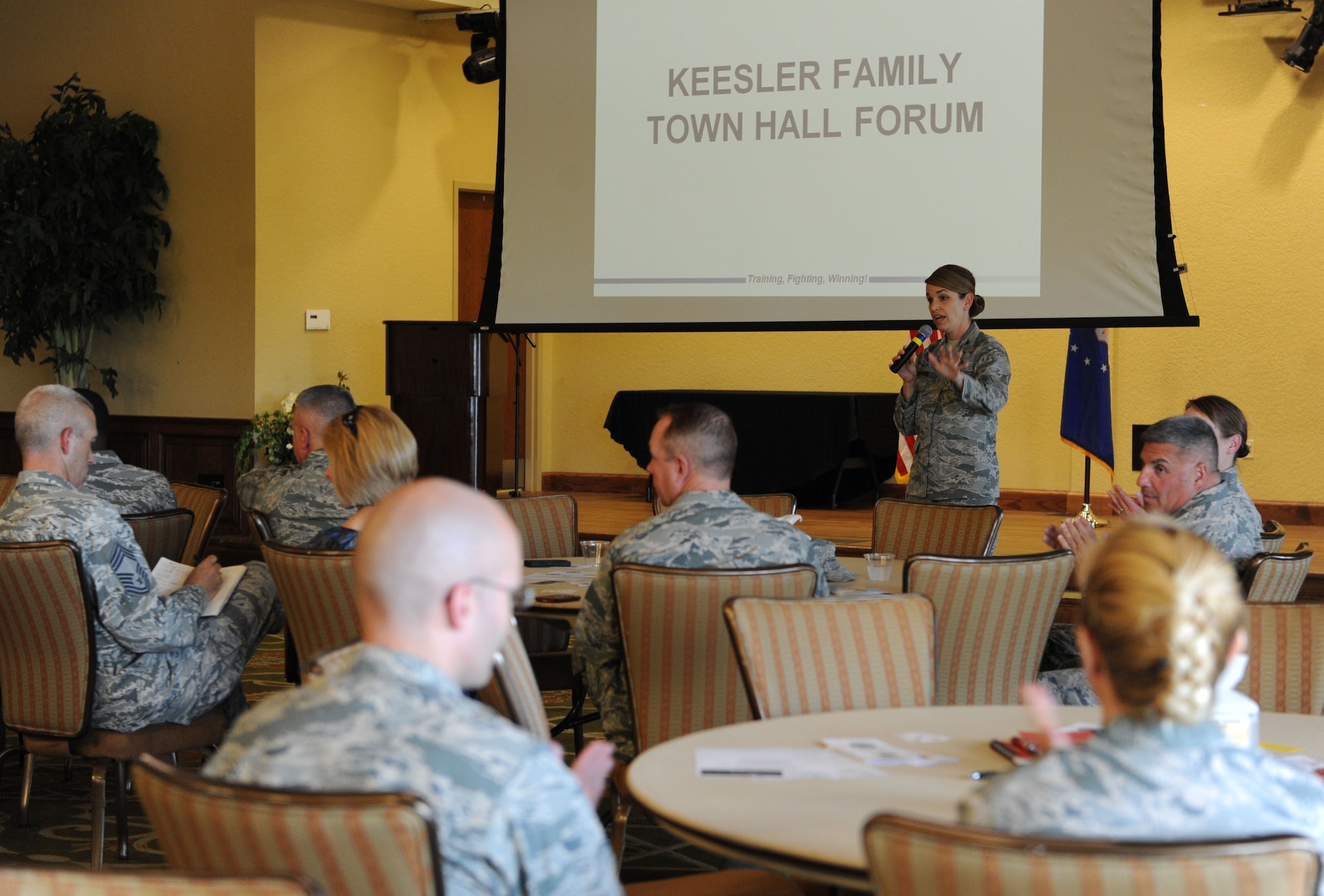 Col. Michele Edmondson, 81st Training Wing commander, speaks to attendees during the Keesler family town hall forum Sept. 15, 2015, at the Bay Breeze Event Center, Keesler Air Force Base, Miss. The forum was hosted by Edmondson to discuss current wing topics followed by a question and answer session. (U.S. Air Force photo by Kemberly Groue)