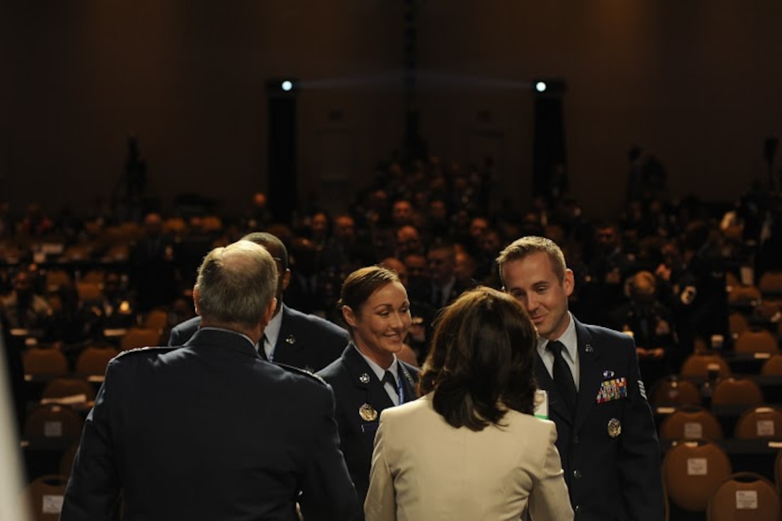 Tech. Sgt. Torri Hendrix and Staff Sgt. Carlin Leslie, members of the Secretary of the Air Force Public Affairs command information section, congratulate Chief of Staff of the Air Force Gen. Mark A. Welsh III and his wife, Betty, on receiving the invitation to the Order of the Sword ceremony during Chief Master Sgt. of the Air Force James A. Cody’s Enlisted Force Update at the Air Force Association Air and Space Conference and Technology Exposition Sept. 16, 2015. The Order of the Sword was established by the Air Force enlisted force to recognize and honor military senior officers, colonel or above, and civilian equivalents, for conspicuous and significant contributions to the welfare and prestige of the Air Force enlisted force, mission effectiveness and the overall military establishment.  (Air Force photo by Staff Sgt. Whitney Stanfield)
