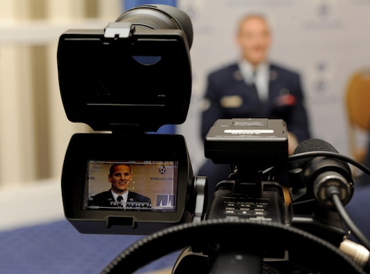 Airman 1st Class Spencer Stone answers question during an interview at the Air Force Association's Air and Space Conference and Technology Exposition in Washington, D.C., Sept. 16, 2015. The conference brings together Air Force leadership, industry experts, academia and current aerospace specialists from around the world to discuss the issues and challenges facing America and the aerospace community today.  (U.S. Air Force photo/Staff Sgt. Whitney Stanfield) 
