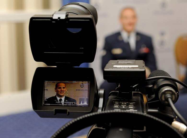 Airman 1st Class Spencer Stone answers question during an interview at the Air Force Association's Air and Space Conference and Technology Exposition in Washington, D.C., Sept. 16, 2015. The conference brings together Air Force leadership, industry experts, academia and current aerospace specialists from around the world to discuss the issues and challenges facing America and the aerospace community today.  (U.S. Air Force photo/Staff Sgt. Whitney Stanfield) 