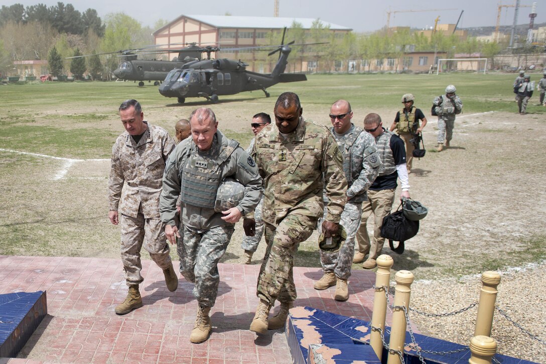 U.S. Army Gen. Martin E. Dempsey, left center, chairman of the Joint Chiefs of Staff, walks with Gen. Lloyd J. Austin III, right center, commander of U.S. Central Command, and U.S. Marine Corps Gen. Joseph F. Dunford Jr., left, commander of the International Security Assistance Force, in Kabul, Afghanistan, April 6, 2013. DoD photo by D. Myles Cullen
