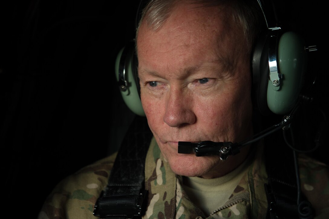 U.S. Army Gen. Martin E. Dempsey, chairman of the Joint Chiefs of Staff, looks out from a helicopter while departing from Resolute Support headquarters in Kabul, Afghanistan, July 19, 2015, where he visited service members supporting the mission. DoD photo by U.S. Navy Petty Officer 1st Class Daniel Hinton