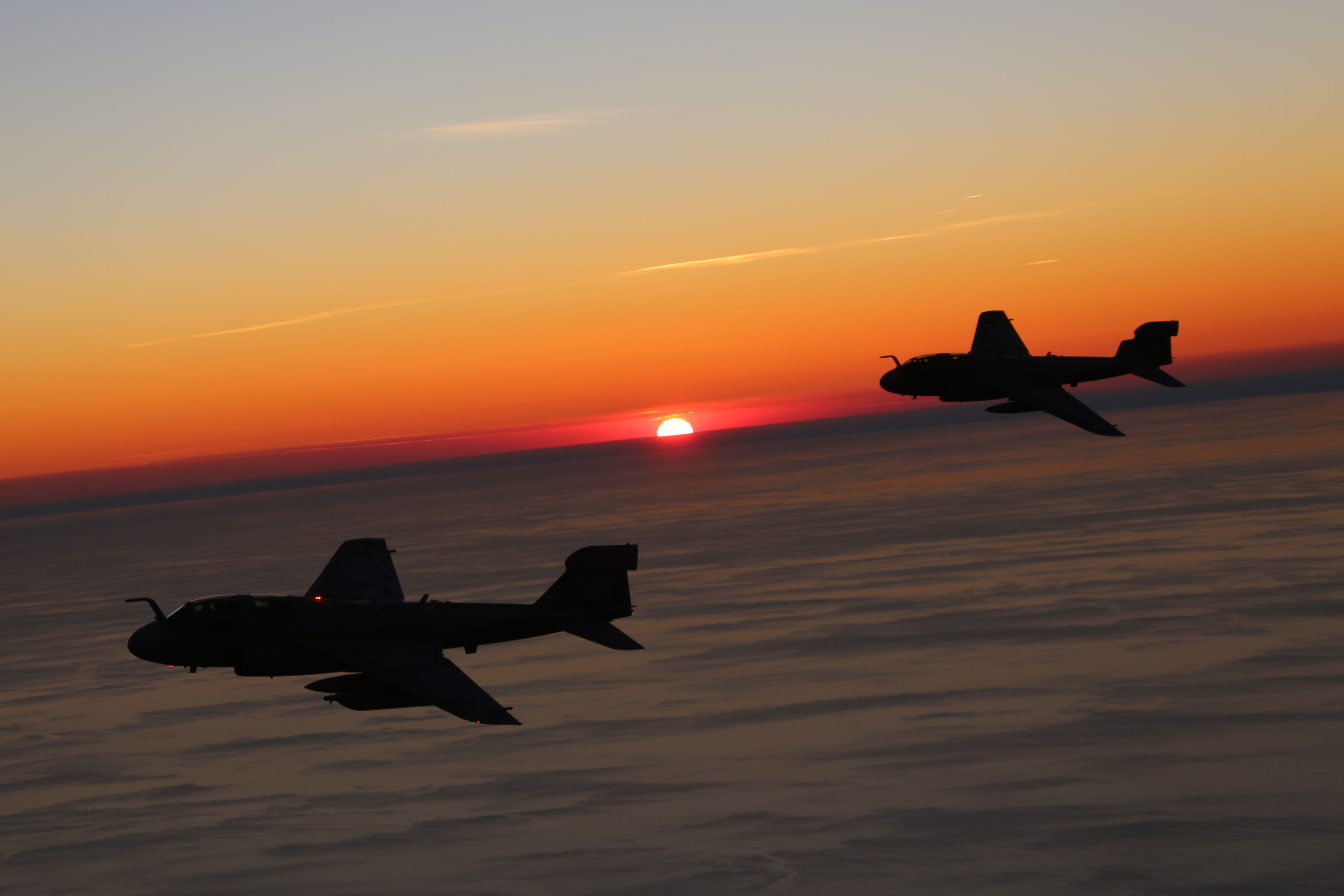 Cherry Point aircraft glide through setting skies