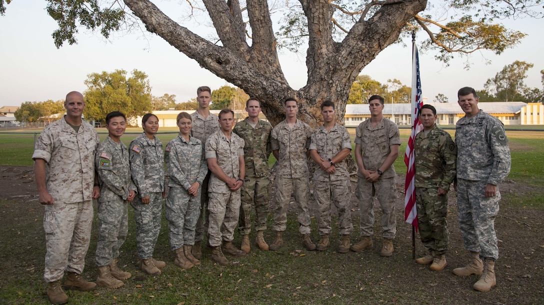 U.S. Army Maj. Gen. Todd McCaffrey, chief of staff , U.S. Army Pacific (far right) and U.S. Marine Corps Col. Daniel Masur, officer in charge of the Forward Coordination Element, Marine Rotational Force – Darwin (far left) pose with soldiers from the 25th Infantry Division, USARPAC and Marines with 1st Battalion, 4th Marine Regiment, MRF-D after the Exercise Kowari 2015 closing ceremony Sept. 12, 2015 at Larrakeyah Barracks, Darwin, Northern Territory, Australia. In its second iteration, Kowari 15 was a trilateral environmental survival training opportunity hosted by Australia and included forces from the U.S., Australia and China simultaneously. 